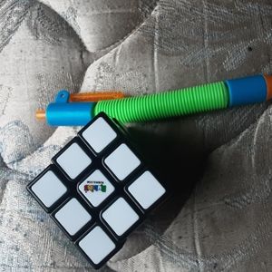 I am selling a rubicks cube and a pop tub pen